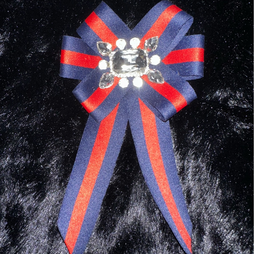 Rhinestoned navy and red ribboned brooch. NWOT.